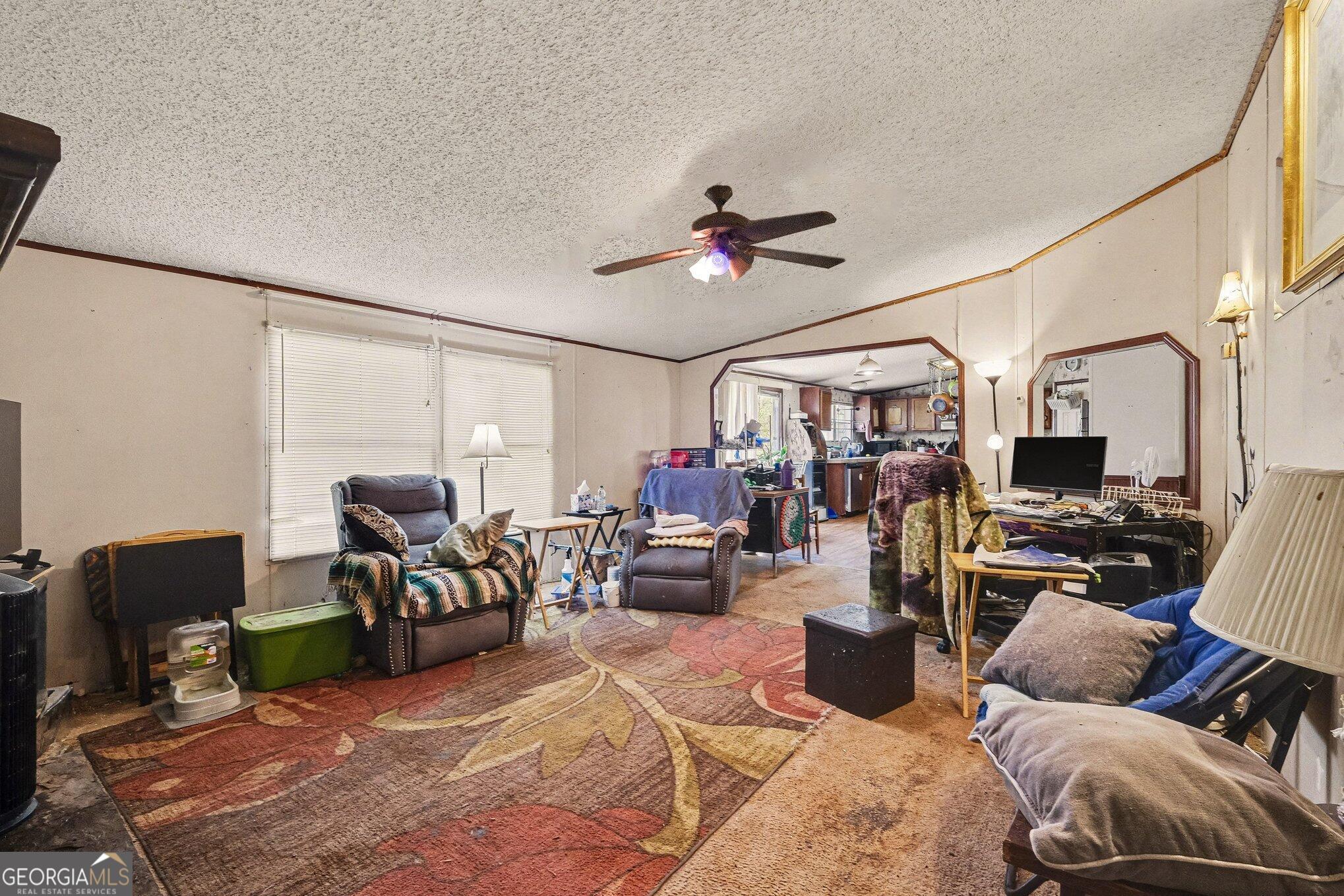 109 Mill Run Comer, GA 30629 - Photo 18 of 23 a living room with furniture and a chandelier