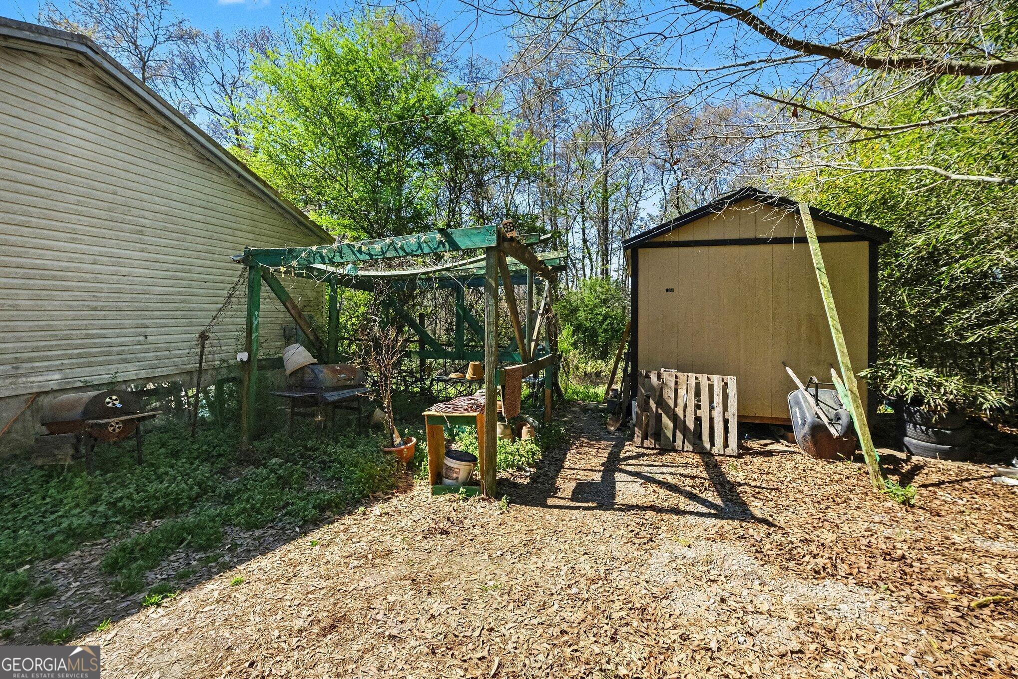 109 Mill Run Comer, GA 30629 - Photo 20 of 23 a view of house with backyard and sitting area