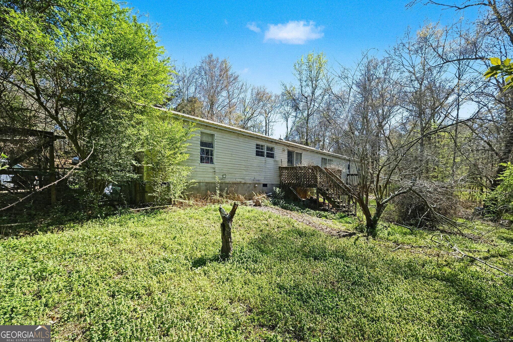 109 Mill Run Comer, GA 30629 - Photo 21 of 23 a backyard of a house with lots of green space