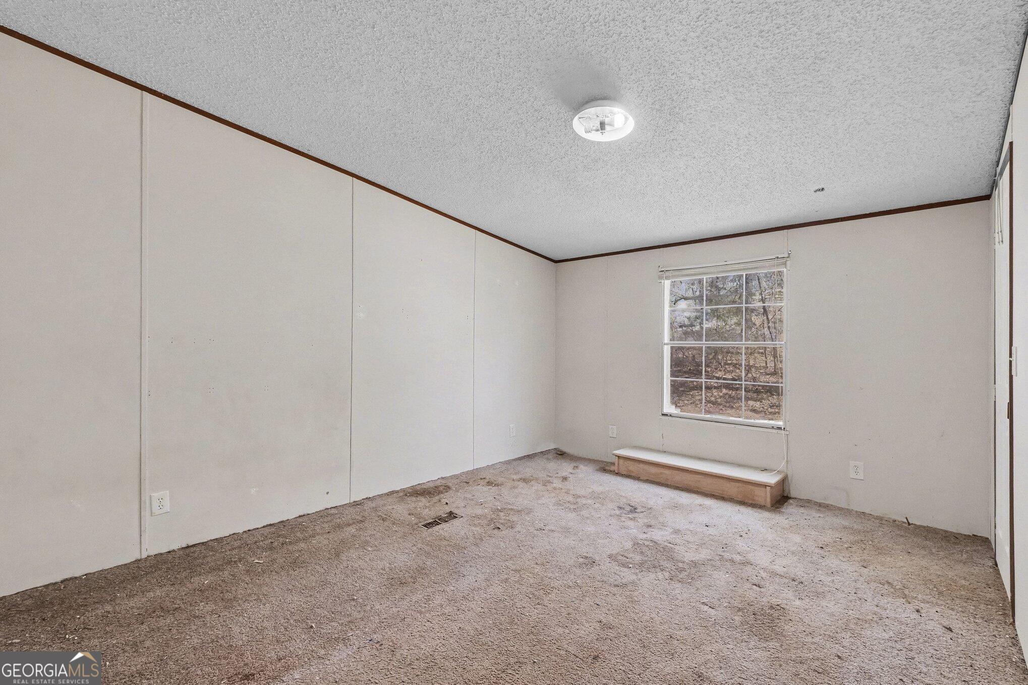 109 Mill Run Comer, GA 30629 - Photo 4 of 23 a view of an empty room with a window