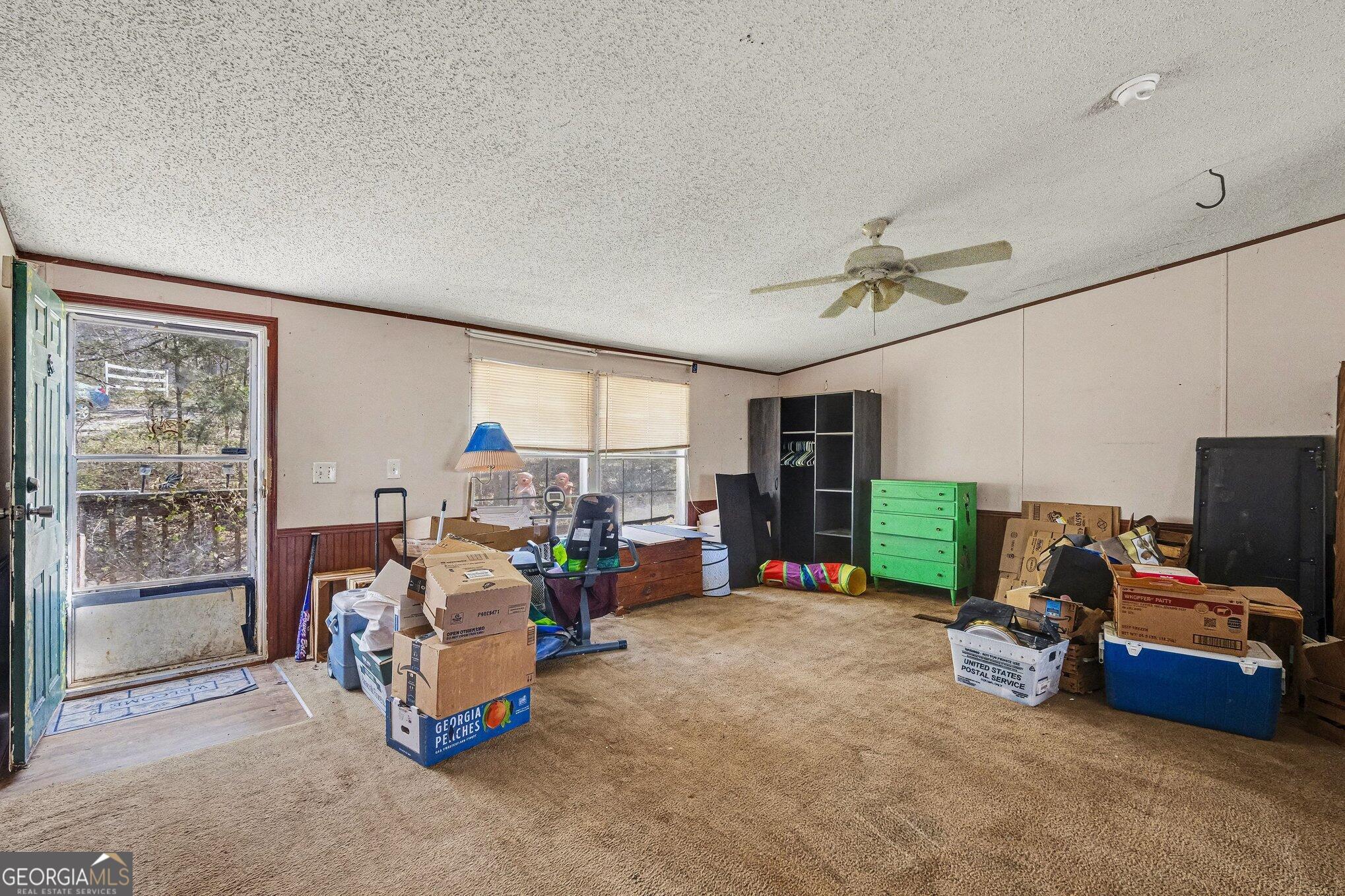 109 Mill Run Comer, GA 30629 - Photo 5 of 23 a view of a livingroom with furniture and a flat screen tv