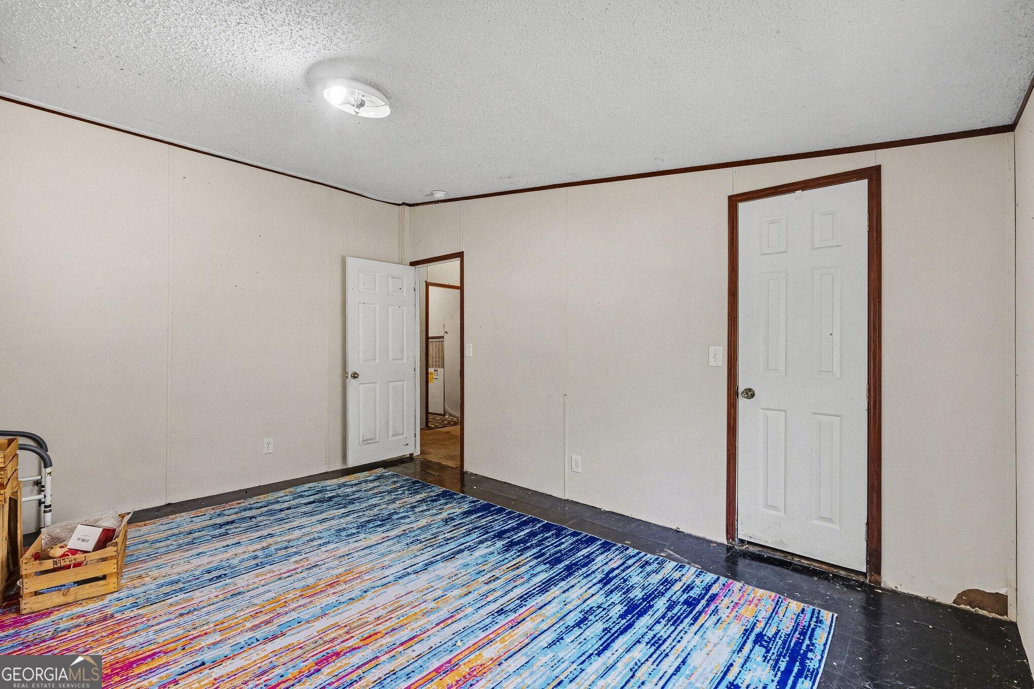 109 Mill Run Comer, GA 30629 - Photo 9 of 23 a view of an empty room with wooden floor