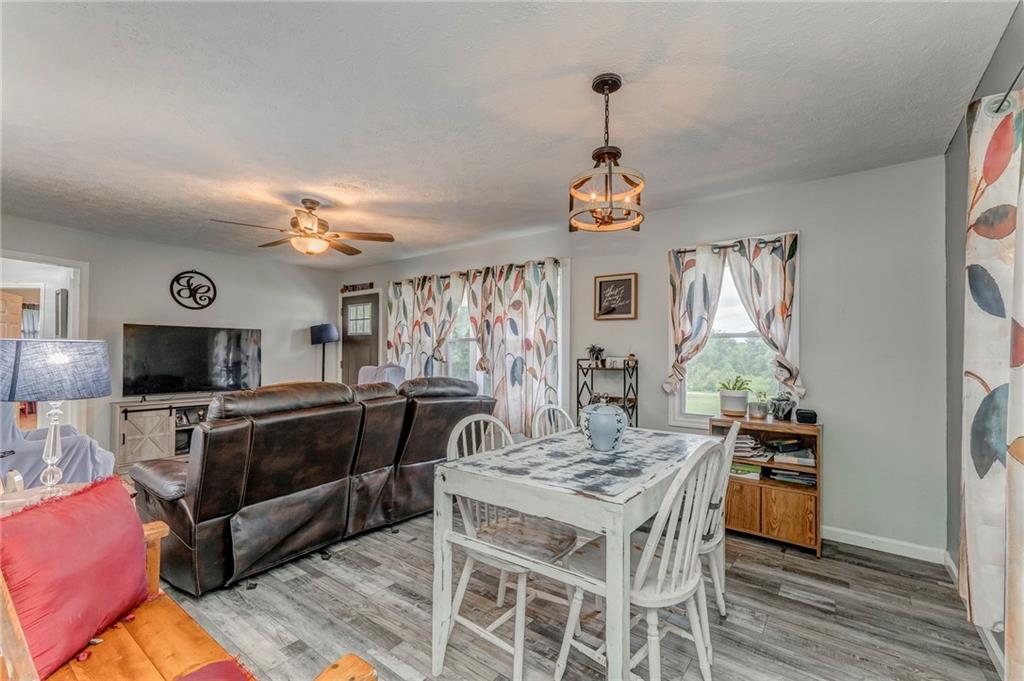 2020 Old Cedartown Road Cedartown, GA 30125 - Photo 11 of 33 a view of a dining room with furniture window and wooden floor
