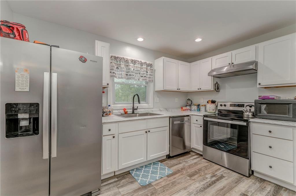 2020 Old Cedartown Road Cedartown, GA 30125 - Photo 12 of 33 a kitchen with stainless steel appliances granite countertop a refrigerator sink and stove