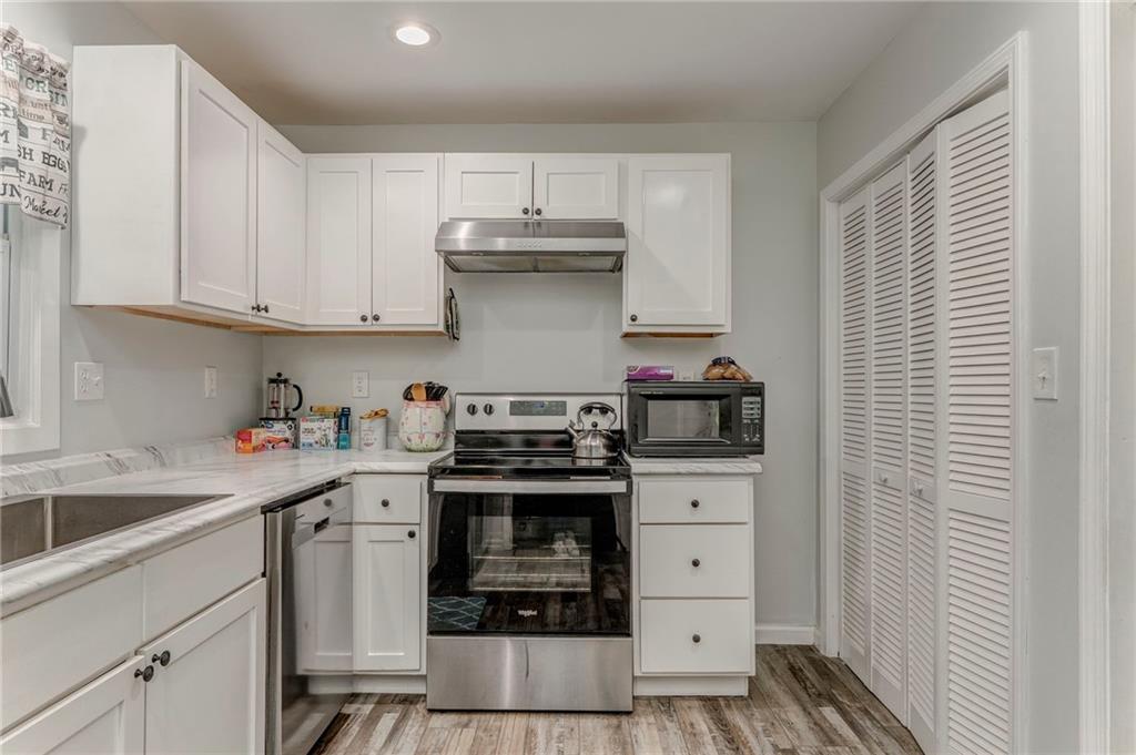 2020 Old Cedartown Road Cedartown, GA 30125 - Photo 13 of 33 a kitchen with white cabinets and appliances