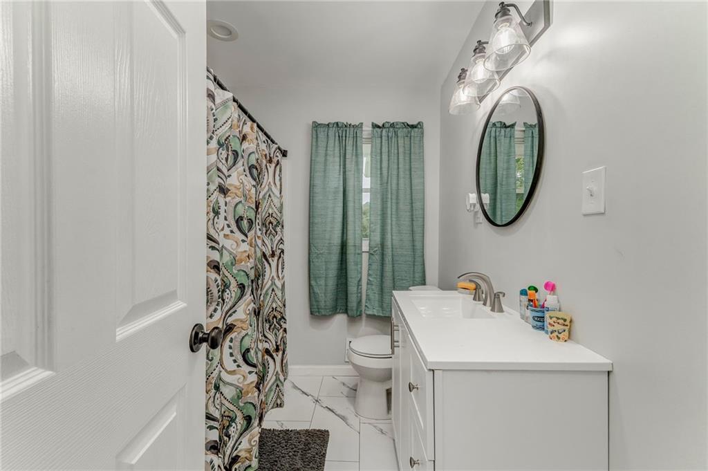 2020 Old Cedartown Road Cedartown, GA 30125 - Photo 20 of 33 a bathroom with a sink toilet and a shower