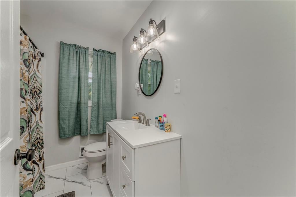 2020 Old Cedartown Road Cedartown, GA 30125 - Photo 21 of 33 a bathroom with a sink toilet and shower