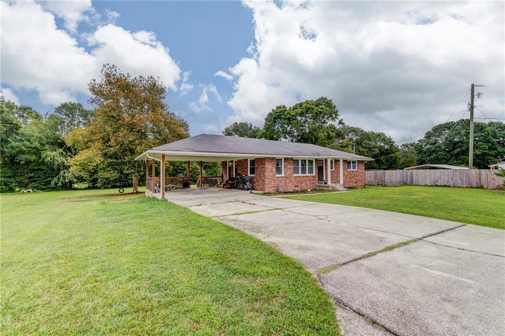 2020 Old Cedartown Road Cedartown, GA 30125 - Photo 5 of 33 a front view of a house with yard patio and green space