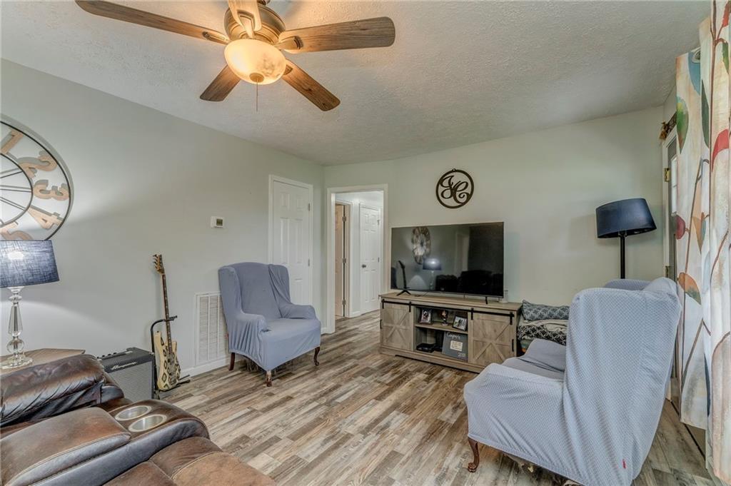 2020 Old Cedartown Road Cedartown, GA 30125 - Photo 9 of 33 a living room with furniture and a flat screen tv