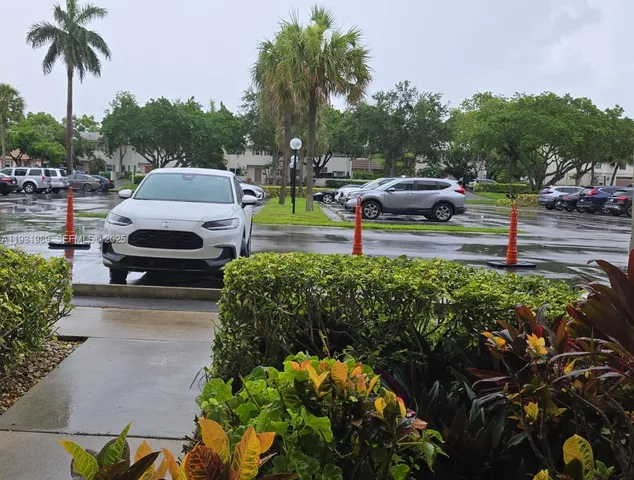 an outdoor space with furniture and umbrella