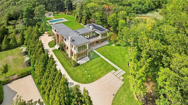 an aerial view of a house with a yard