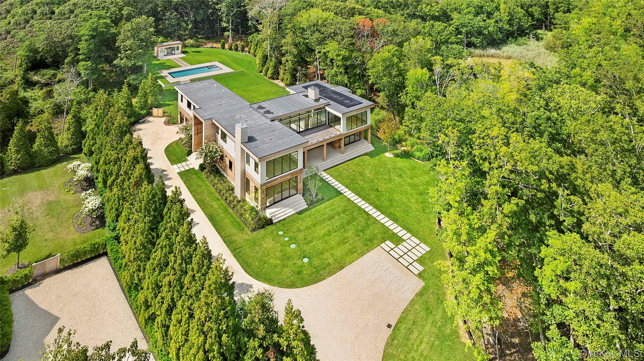 27 Fresh Pond Road North Haven, NY 11963 - Photo 24 of 26 an aerial view of a house with a yard