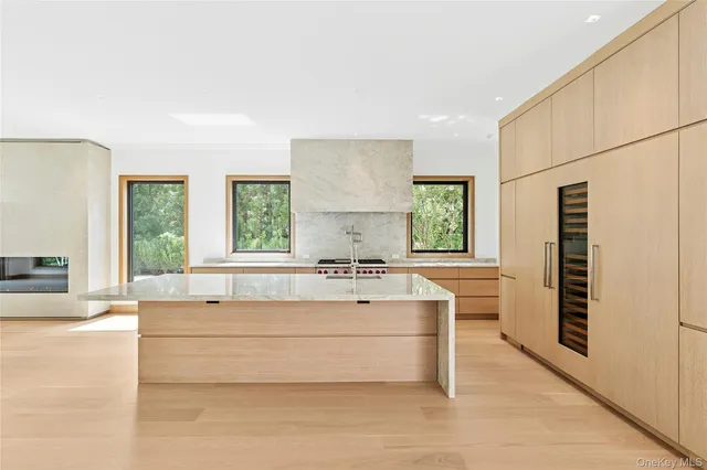 a spacious bathroom with a bathtub a sink and a window