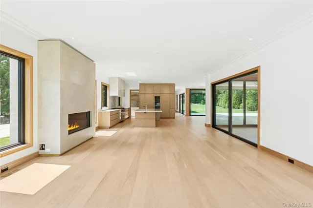 a view of a living room with furniture and a fireplace