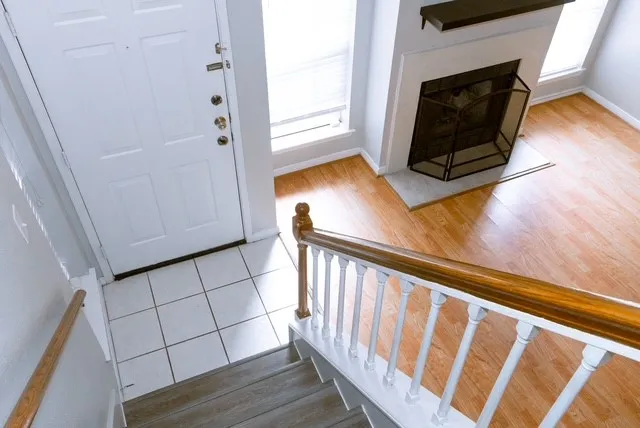 a view of a livingroom with wooden floor and fireplace