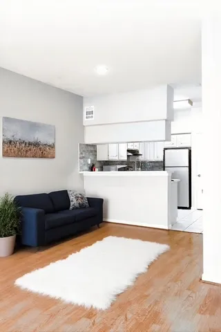 a bedroom with a bed and cabinets