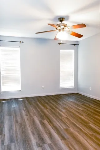 a room with two beds and painting on the wall