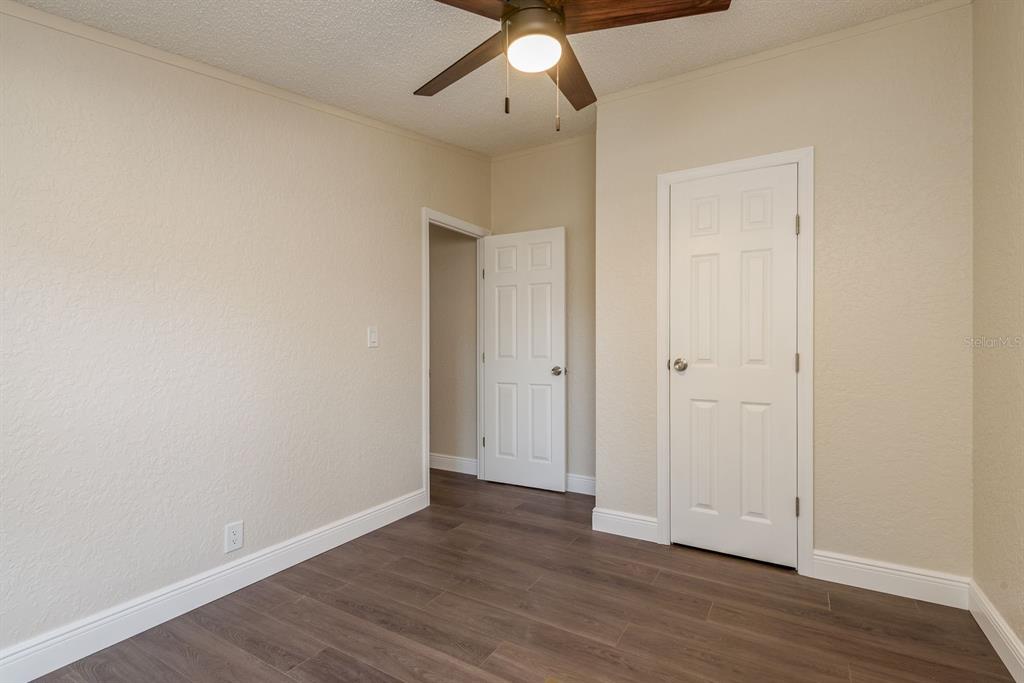 6707 Celeste Lane New Port Richey, FL 34653 - Photo 18 of 21 a view of an empty room with wooden floor