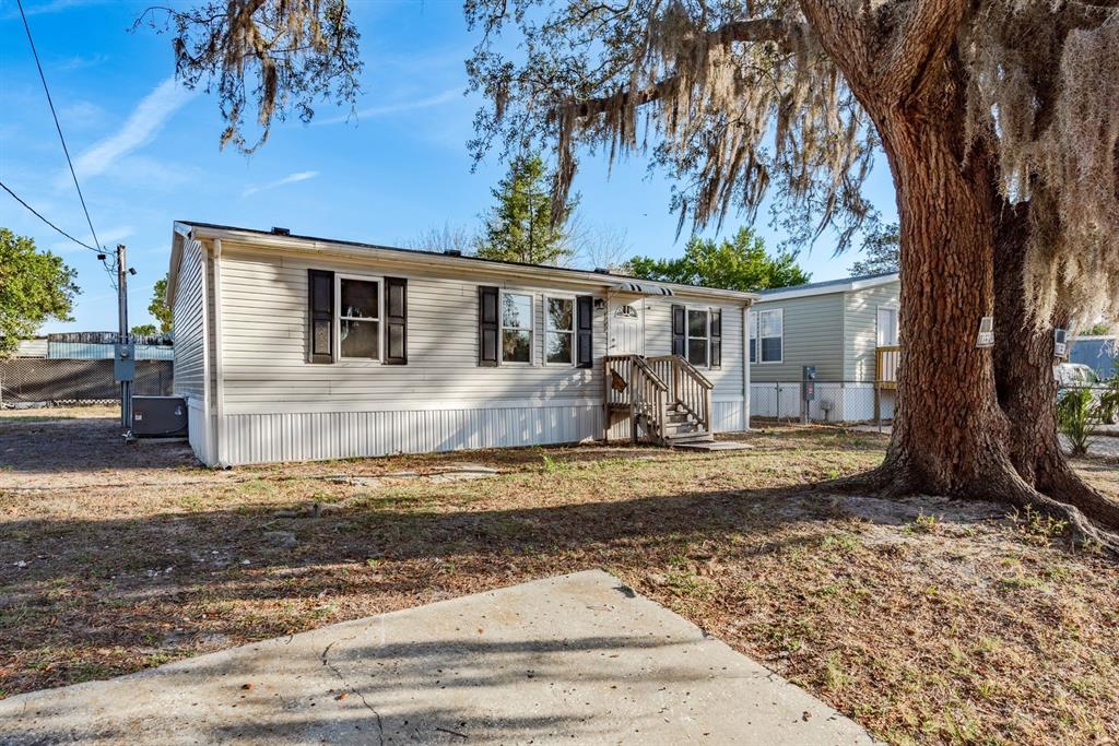 6707 Celeste Lane New Port Richey, FL 34653 - Photo 2 of 21 a view of a house with a yard