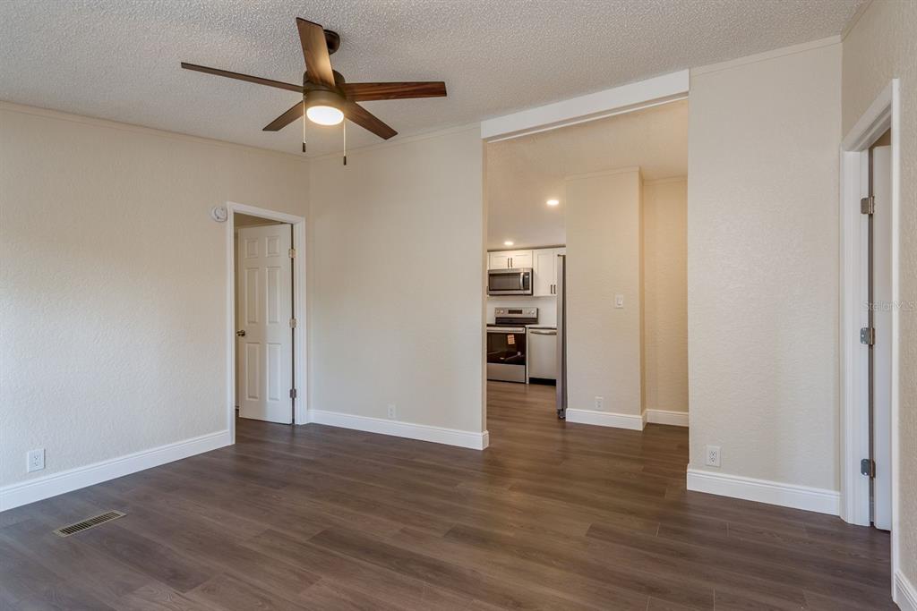 6707 Celeste Lane New Port Richey, FL 34653 - Photo 3 of 21 a view of empty room with wooden floor