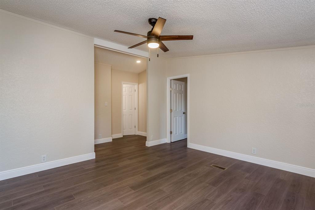 6707 Celeste Lane New Port Richey, FL 34653 - Photo 6 of 21 a view of an empty room and wooden floor
