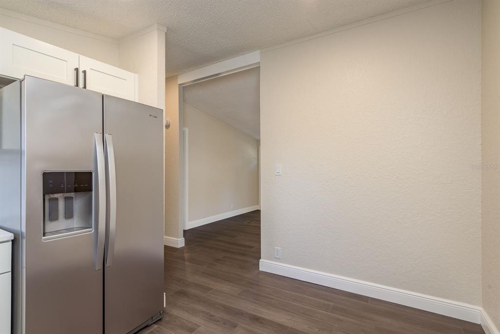 6707 Celeste Lane New Port Richey, FL 34653 - Photo 10 of 21 a view of a hardwood in an empty room
