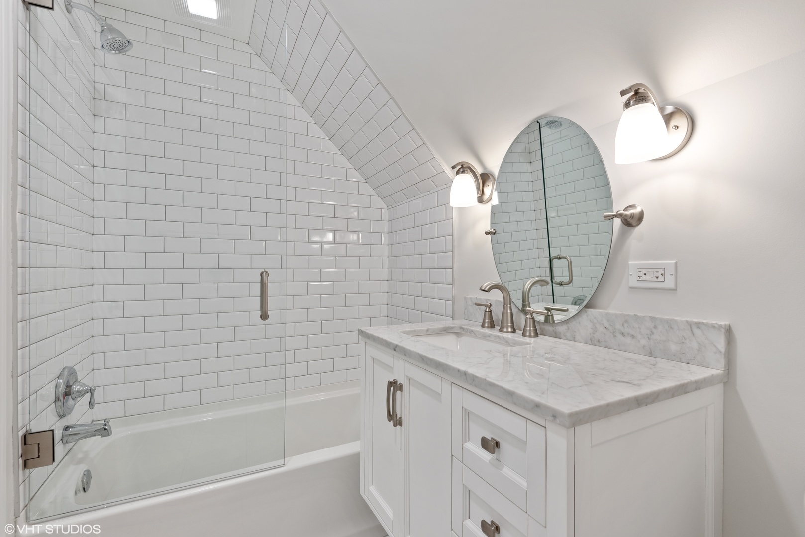 1131 Ridge Road, Unit 2 Wilmette, IL 60091 - Photo 8 of 11 a bathroom with a sink vanity tub and a mirror
