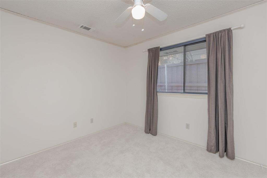 1106 Derby Run Carrollton, TX 75007 - Photo 19 of 26 an empty room with a empty space and windows