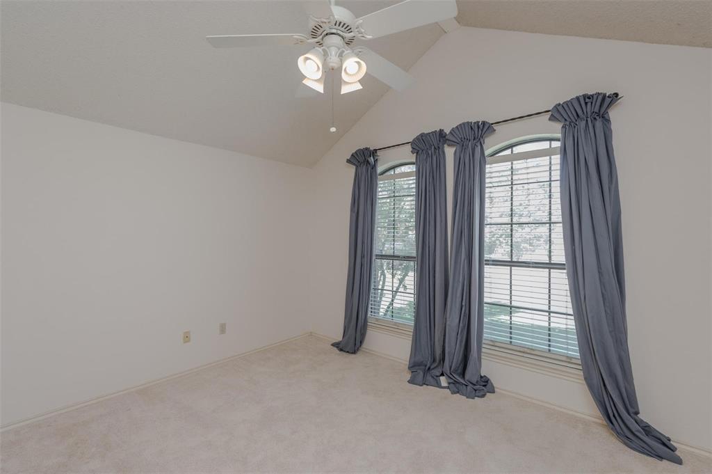 1106 Derby Run Carrollton, TX 75007 - Photo 20 of 26 an empty room with windows and closet