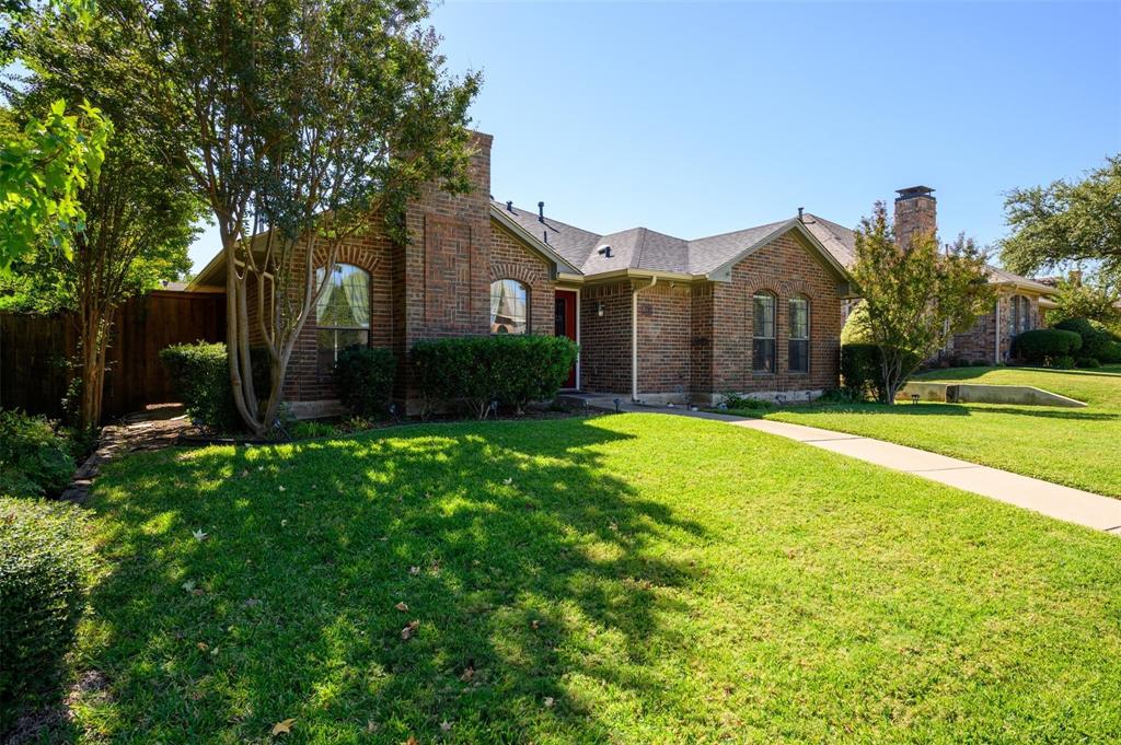 1106 Derby Run Carrollton, TX 75007 - Photo 2 of 26 a front view of house with yard and green space