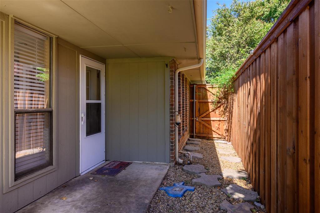 1106 Derby Run Carrollton, TX 75007 - Photo 22 of 26 a view of a house with a backyard