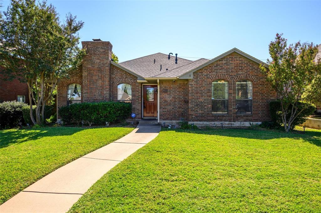 1106 Derby Run Carrollton, TX 75007 - Photo 26 of 26 a front view of a house with garden