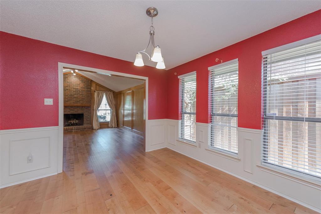 1106 Derby Run Carrollton, TX 75007 - Photo 7 of 26 a view of a room with wooden floor and windows