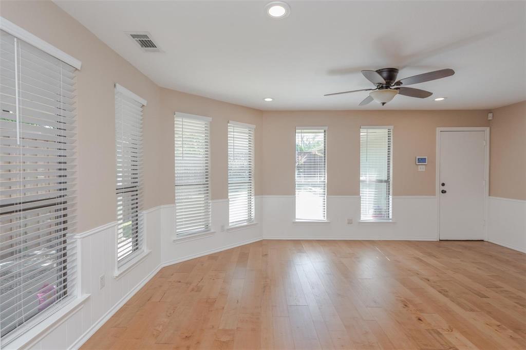 1106 Derby Run Carrollton, TX 75007 - Photo 8 of 26 a view of an empty room with a window and wooden floor