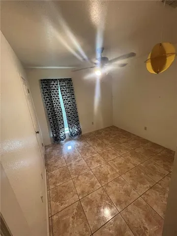 a view of an empty room with windows