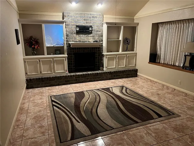 a view of kitchen with stove and refrigerator