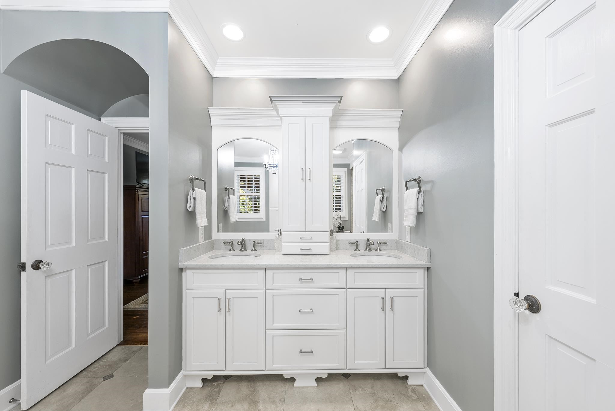 7709 Rainwater Road Raleigh, NC 27615 - Photo 24 of 54 a spacious bathroom with a double vanity sink a mirror and a shower