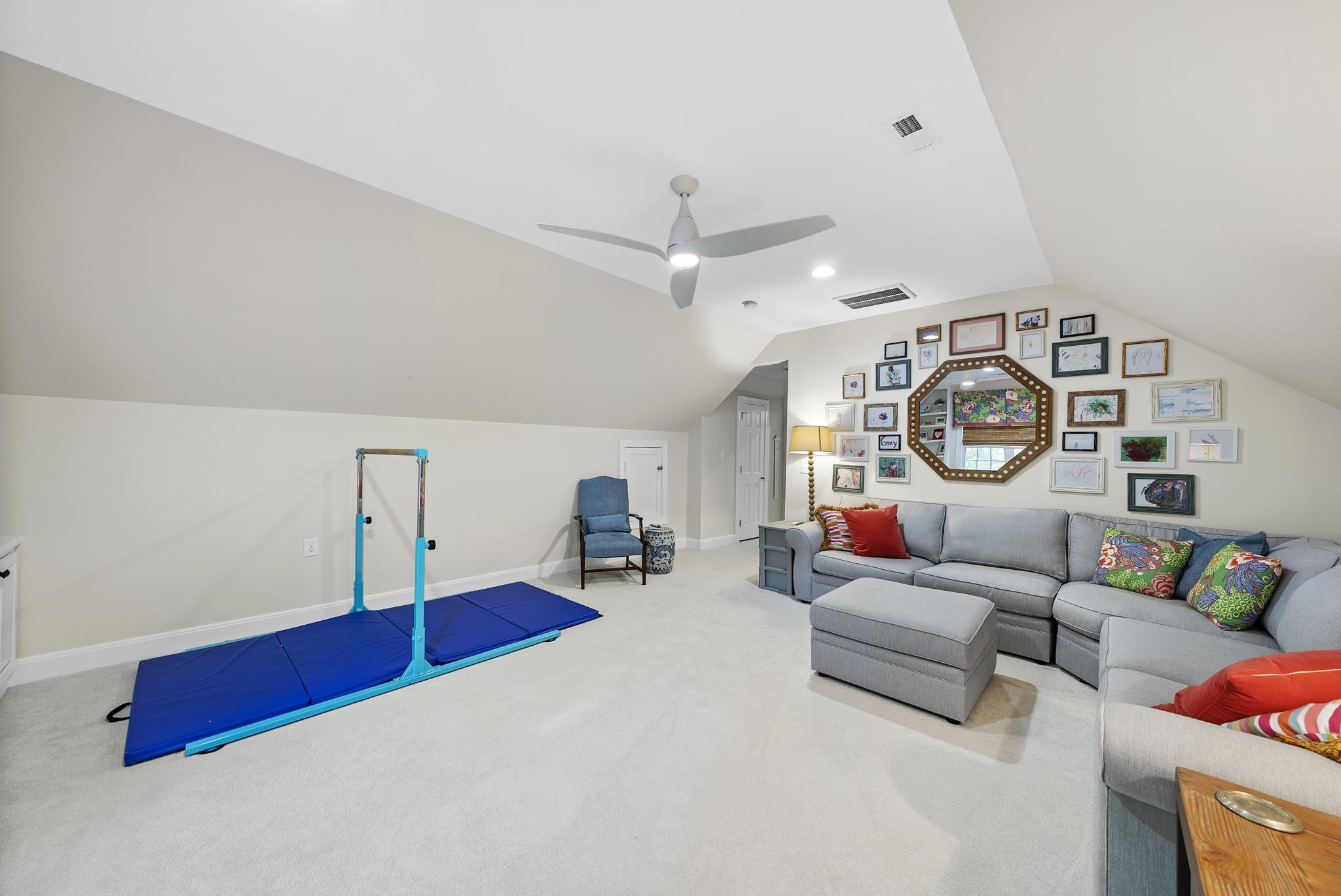 7709 Rainwater Road Raleigh, NC 27615 - Photo 36 of 54 a living room with furniture and a clock