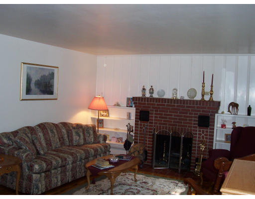 78 West Townsend Road Lunenburg, MA 01462 - Photo 3 of 10 a living room with furniture and a fireplace