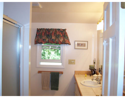 78 West Townsend Road Lunenburg, MA 01462 - Photo 7 of 10 a bathroom with a sink and a mirror