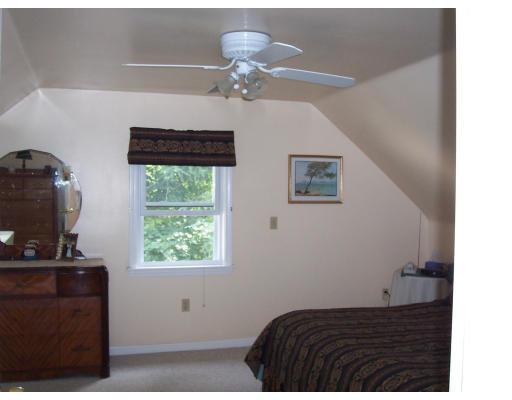 78 West Townsend Road Lunenburg, MA 01462 - Photo 8 of 10 a bedroom with a bed and a window