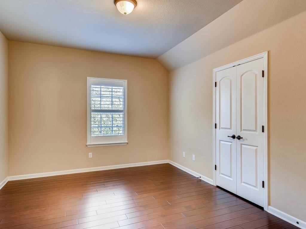 215 Reveille Road Austin, TX 78746 - Photo 27 of 40 Upstairs bedroom 2 with its own bathroom