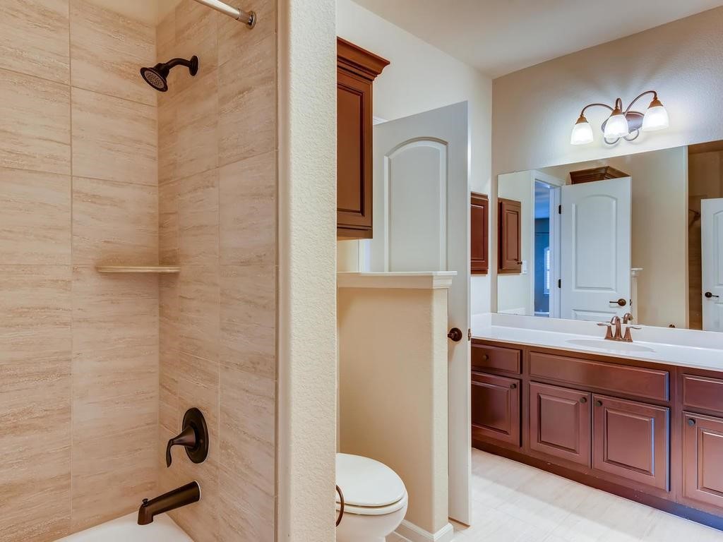 215 Reveille Road Austin, TX 78746 - Photo 28 of 40 Bathroom open to bedroom2 and hall