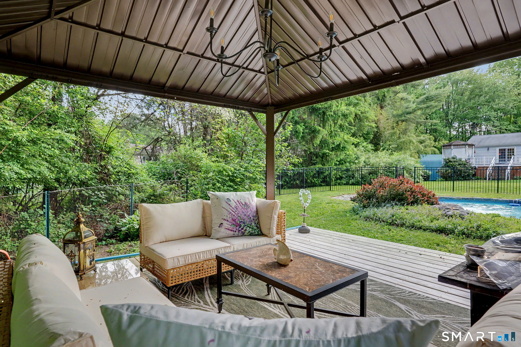 571 Wheeler Road Monroe, CT 06468 - Photo 32 of 40 a view of a patio with a table chairs and a backyard