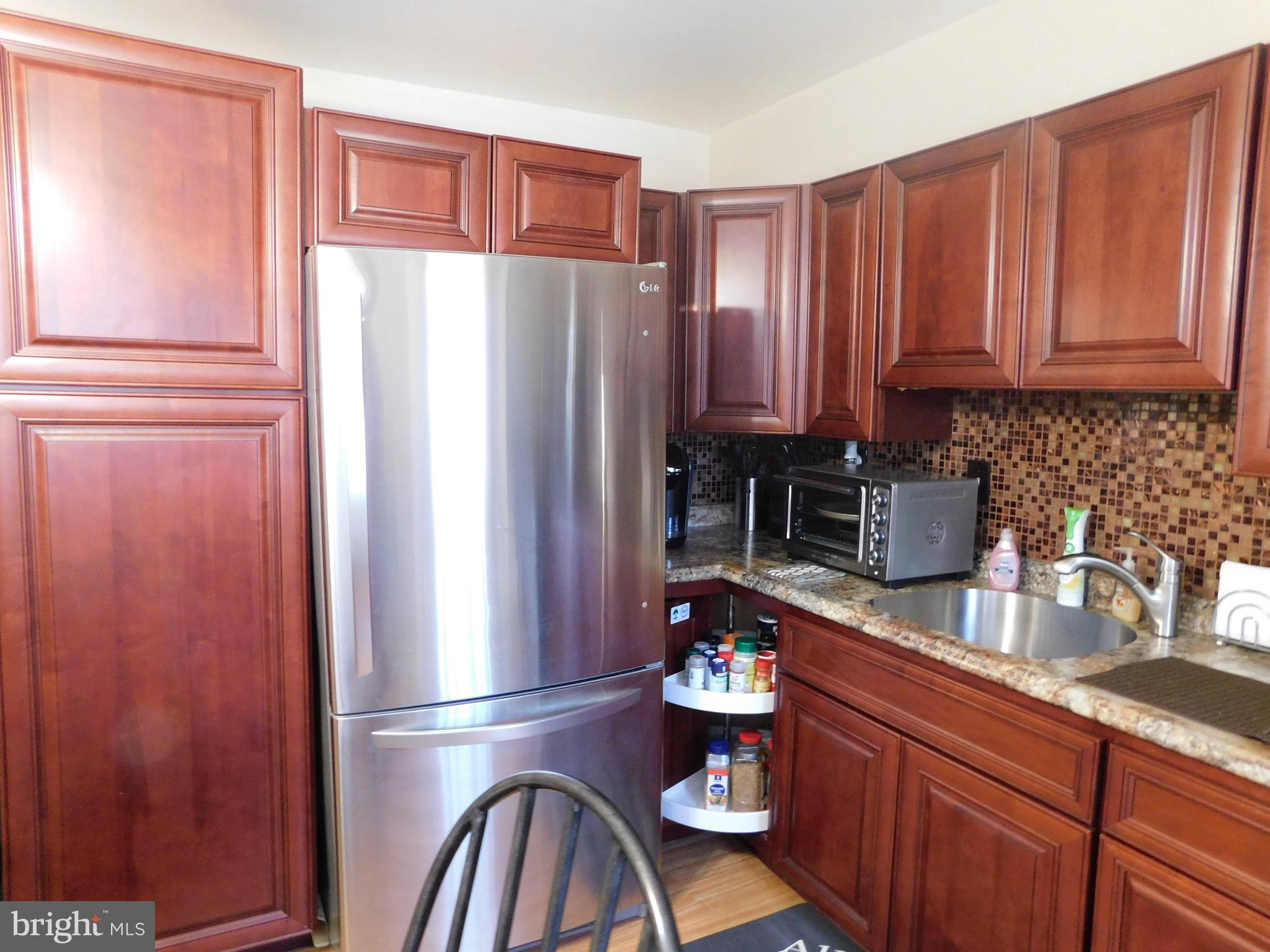 1333 Deanwood Road Baltimore, MD 21234 - Photo 2 of 40 a kitchen with stainless steel appliances granite countertop a refrigerator a sink and dishwasher