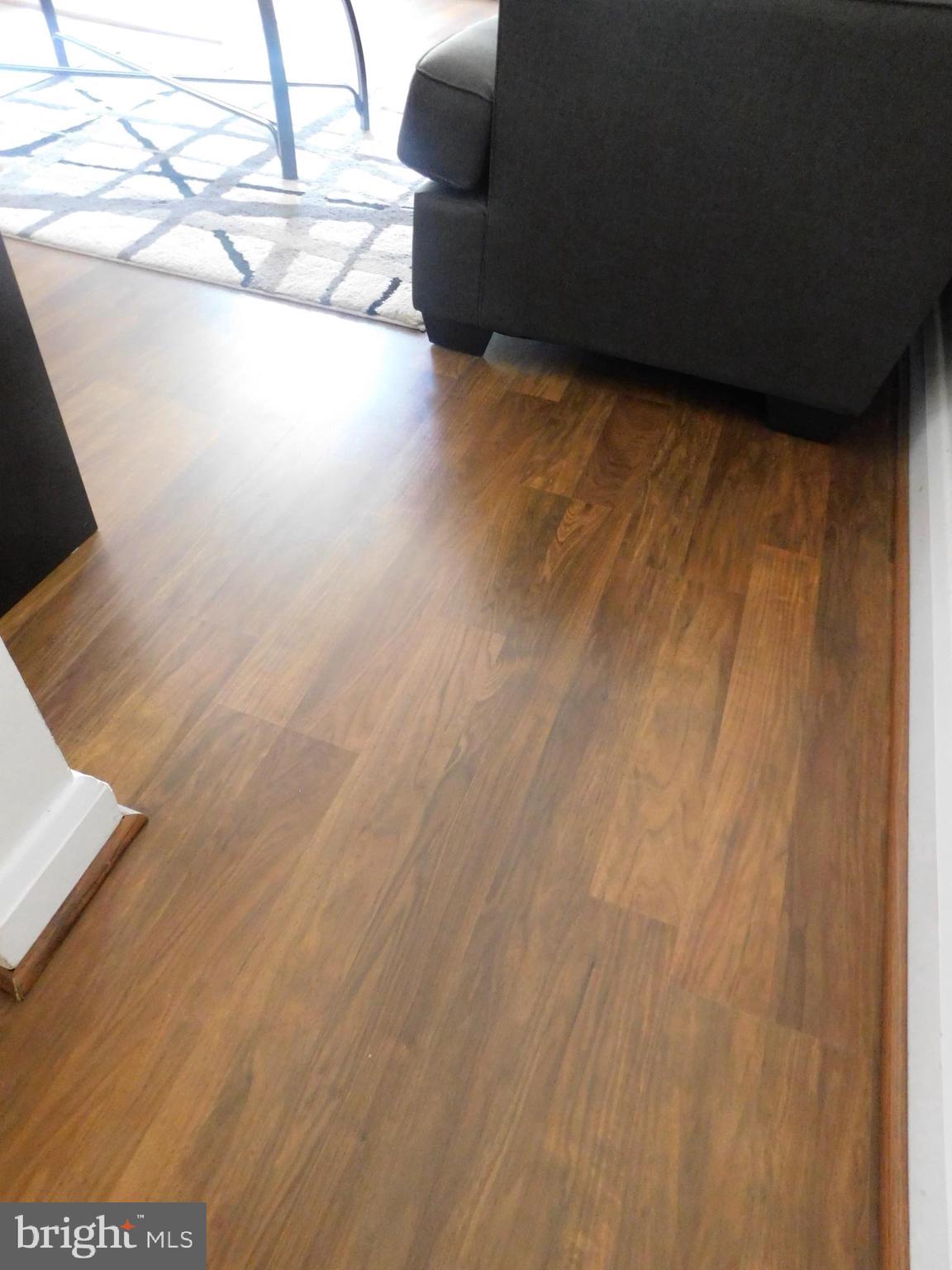 1333 Deanwood Road Baltimore, MD 21234 - Photo 15 of 40 a view of an empty room with wooden floor