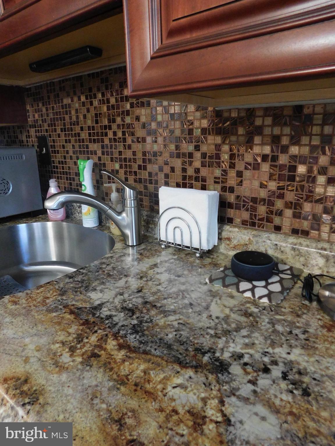1333 Deanwood Road Baltimore, MD 21234 - Photo 3 of 40 a kitchen with a sink and cabinets