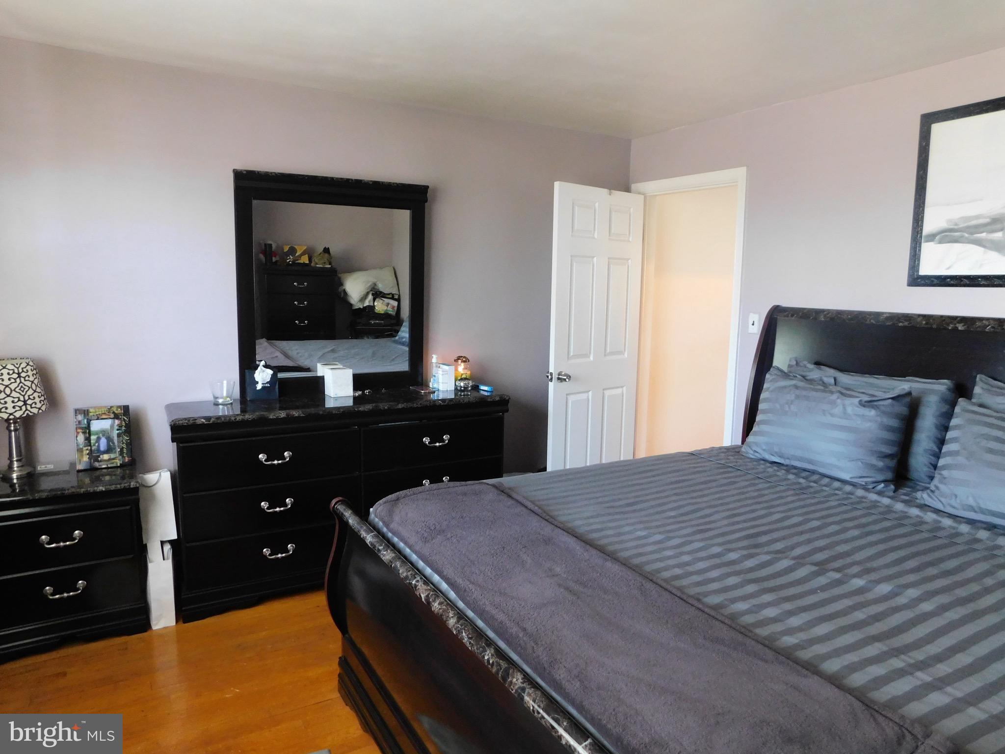 1333 Deanwood Road Baltimore, MD 21234 - Photo 21 of 40 a bedroom with a bed and a dresser