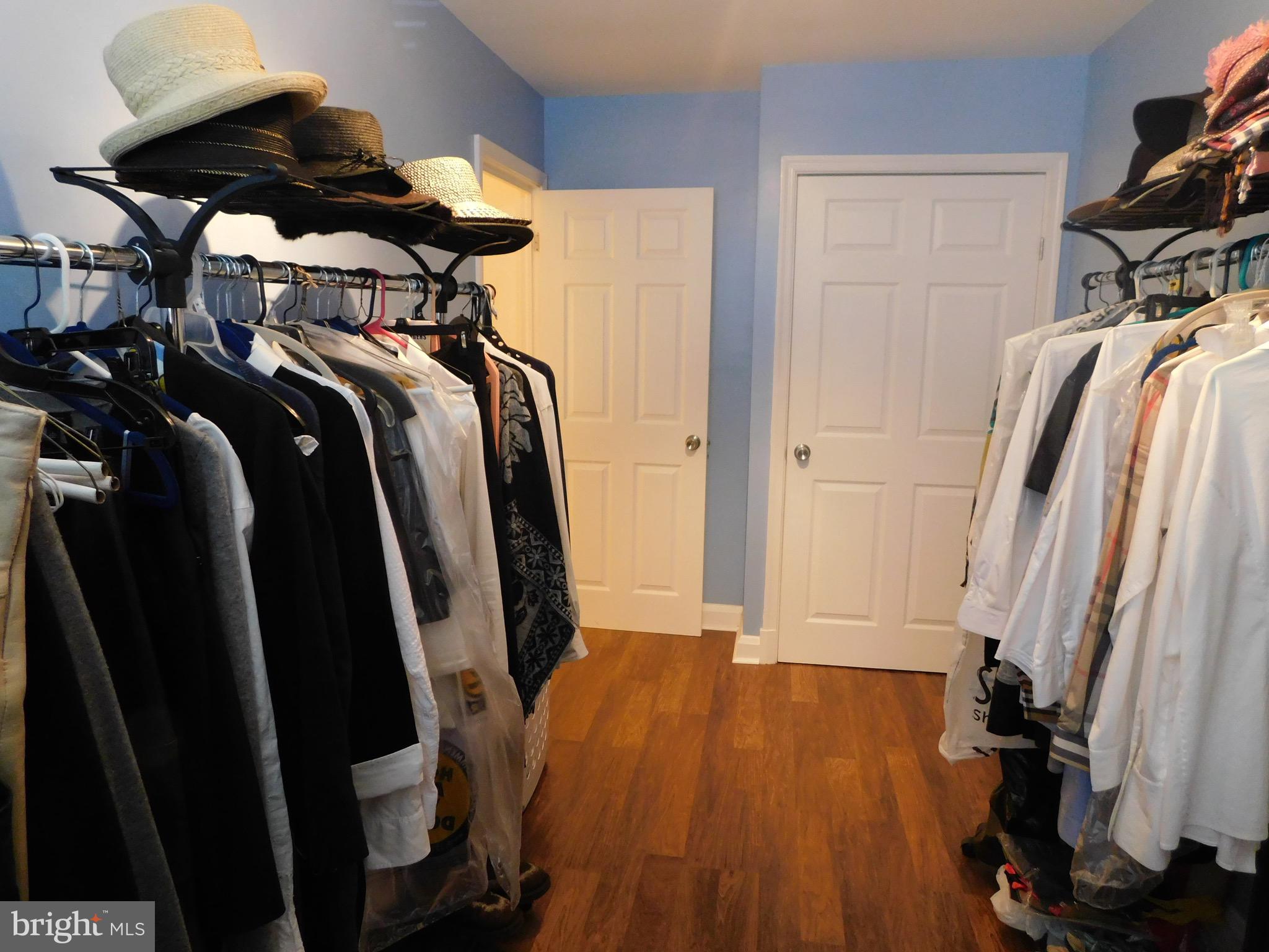 1333 Deanwood Road Baltimore, MD 21234 - Photo 25 of 40 a view of walk in closet with clothes and shoes