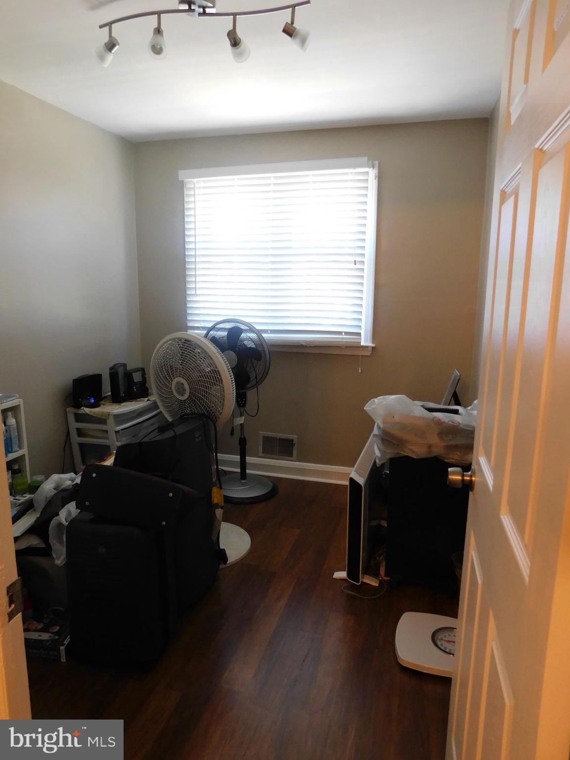 1333 Deanwood Road Baltimore, MD 21234 - Photo 26 of 40 a view of a workspace with furniture and a window